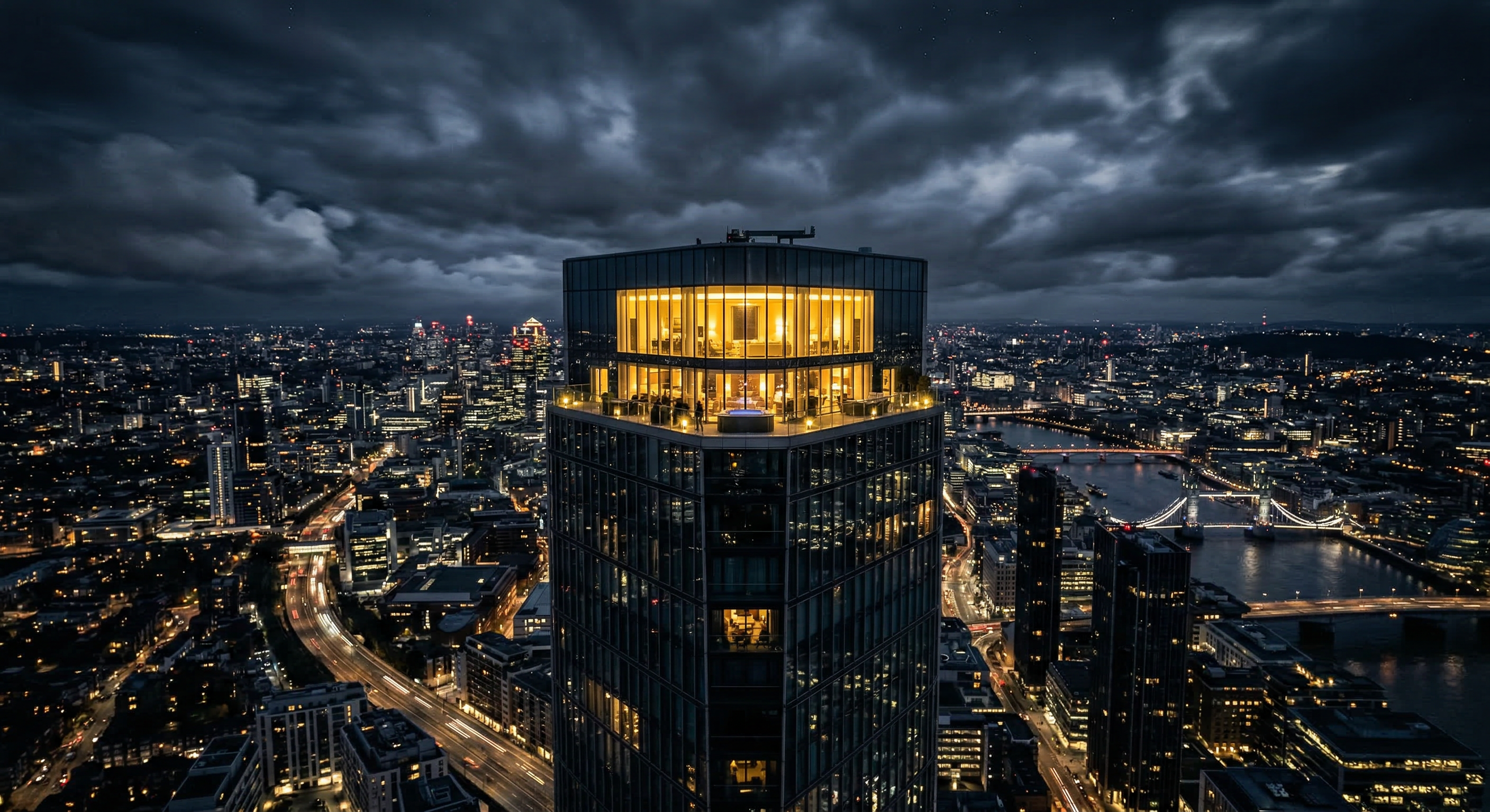 Aerial view of Meridian Tower penthouse glowing at night